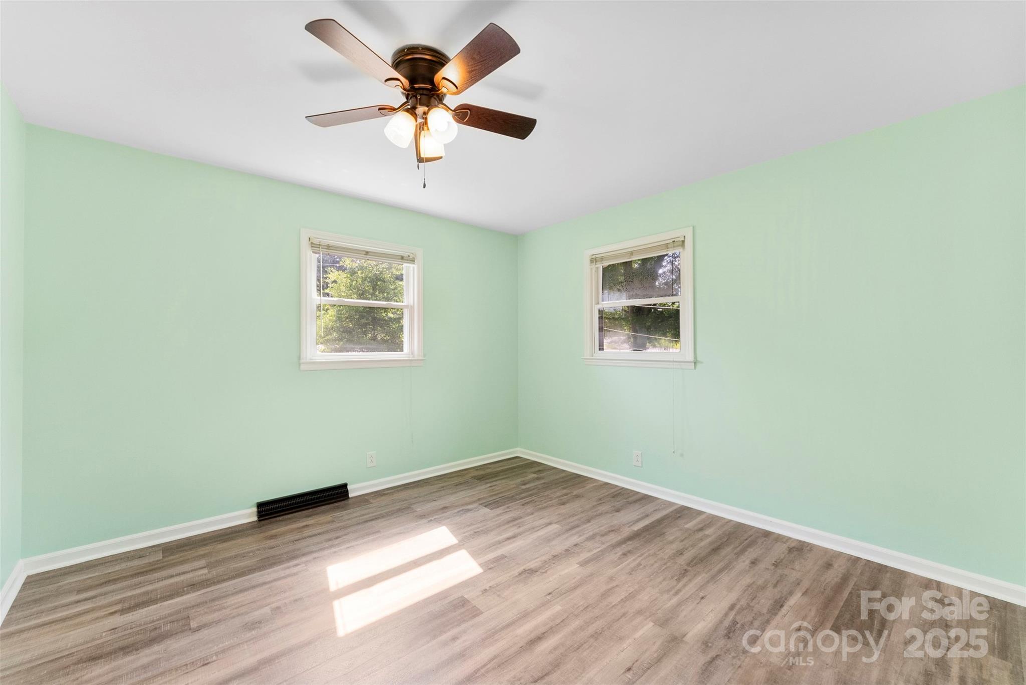 1822 North New Hope Road Gastonia, NC 28054 - Photo 37 of 47 a view of a big room with wooden floor and a chandelier fan