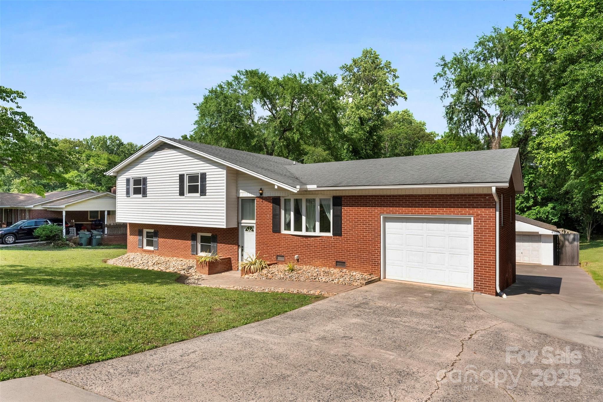 1822 North New Hope Road Gastonia, NC 28054 - Photo 39 of 47 a front view of a house with a yard and trees