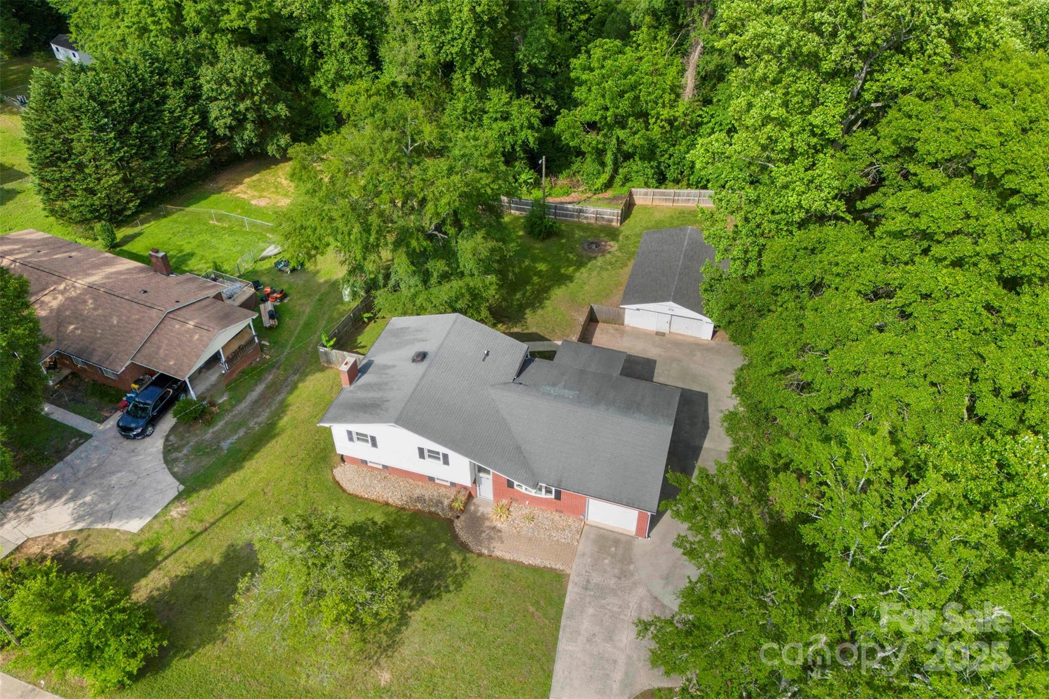1822 North New Hope Road Gastonia, NC 28054 - Photo 4 of 47 an aerial view of a house with a yard and trees