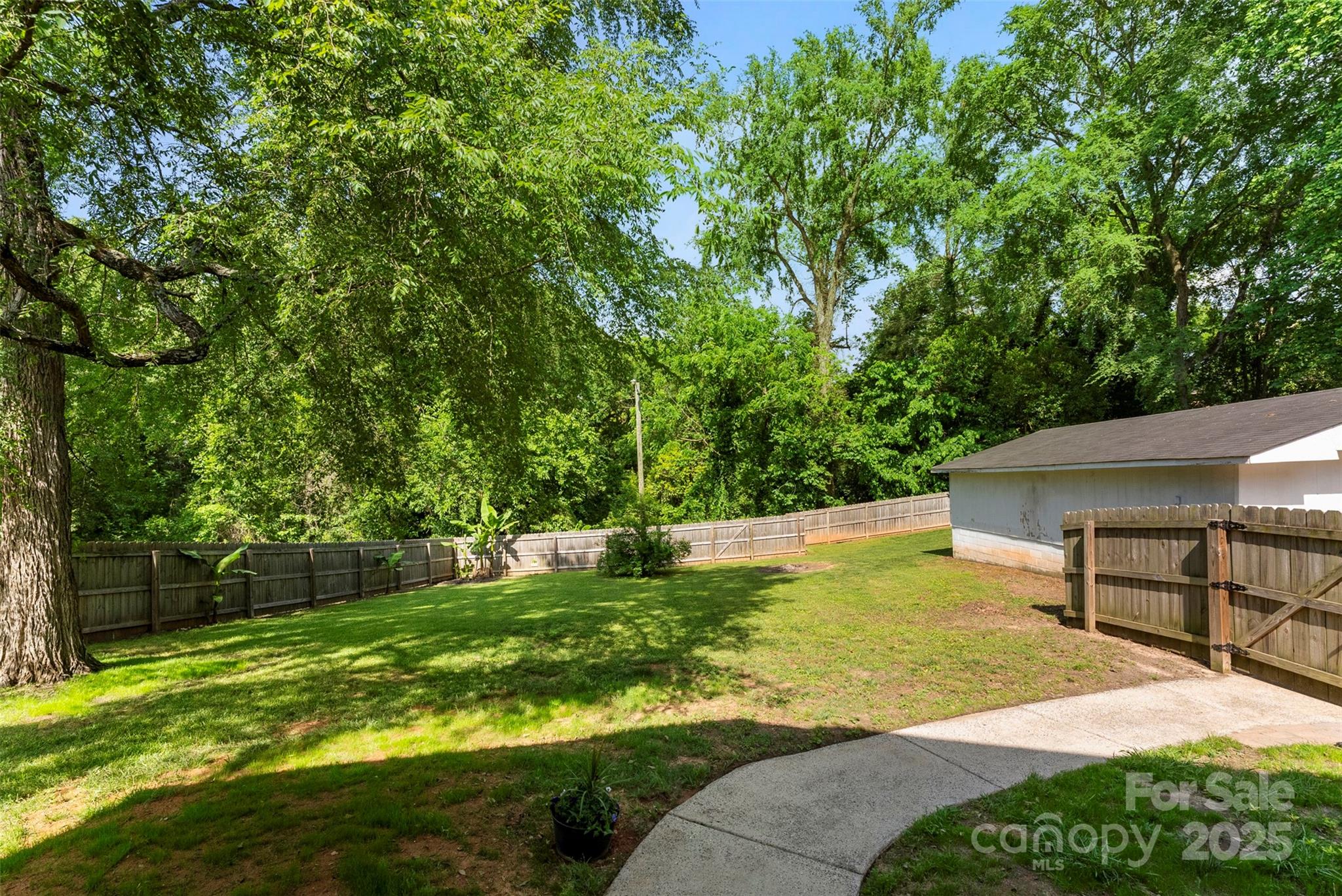 1822 North New Hope Road Gastonia, NC 28054 - Photo 45 of 47 a view of a backyard with a garden