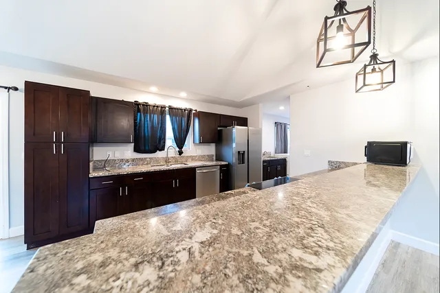 a large bathroom with a sink and a large mirror