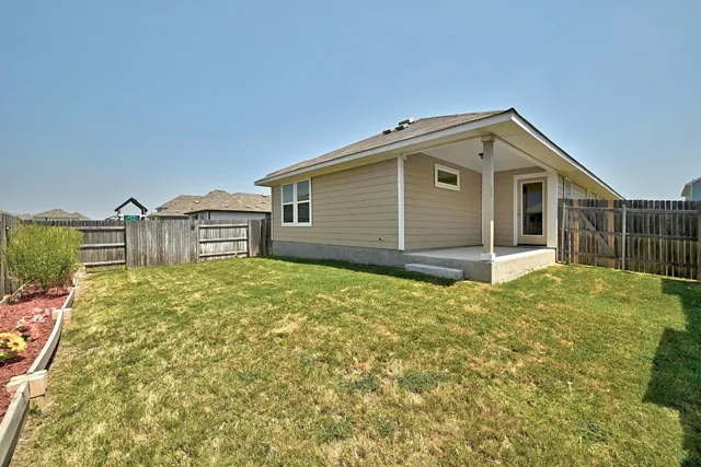 a house view with a garden space
