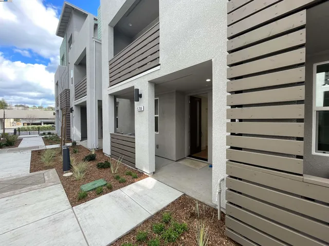 a view of a balcony with chairs