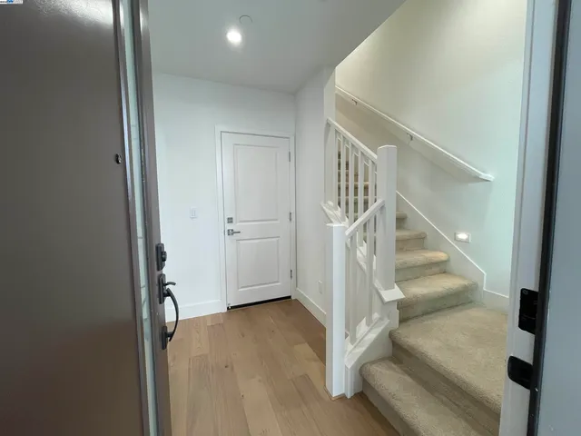 a view of entryway with wooden floor