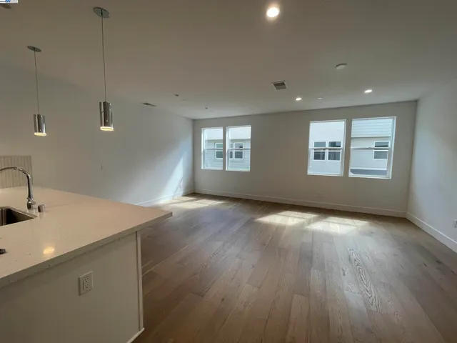 a view of a kitchen that shows a sink in it