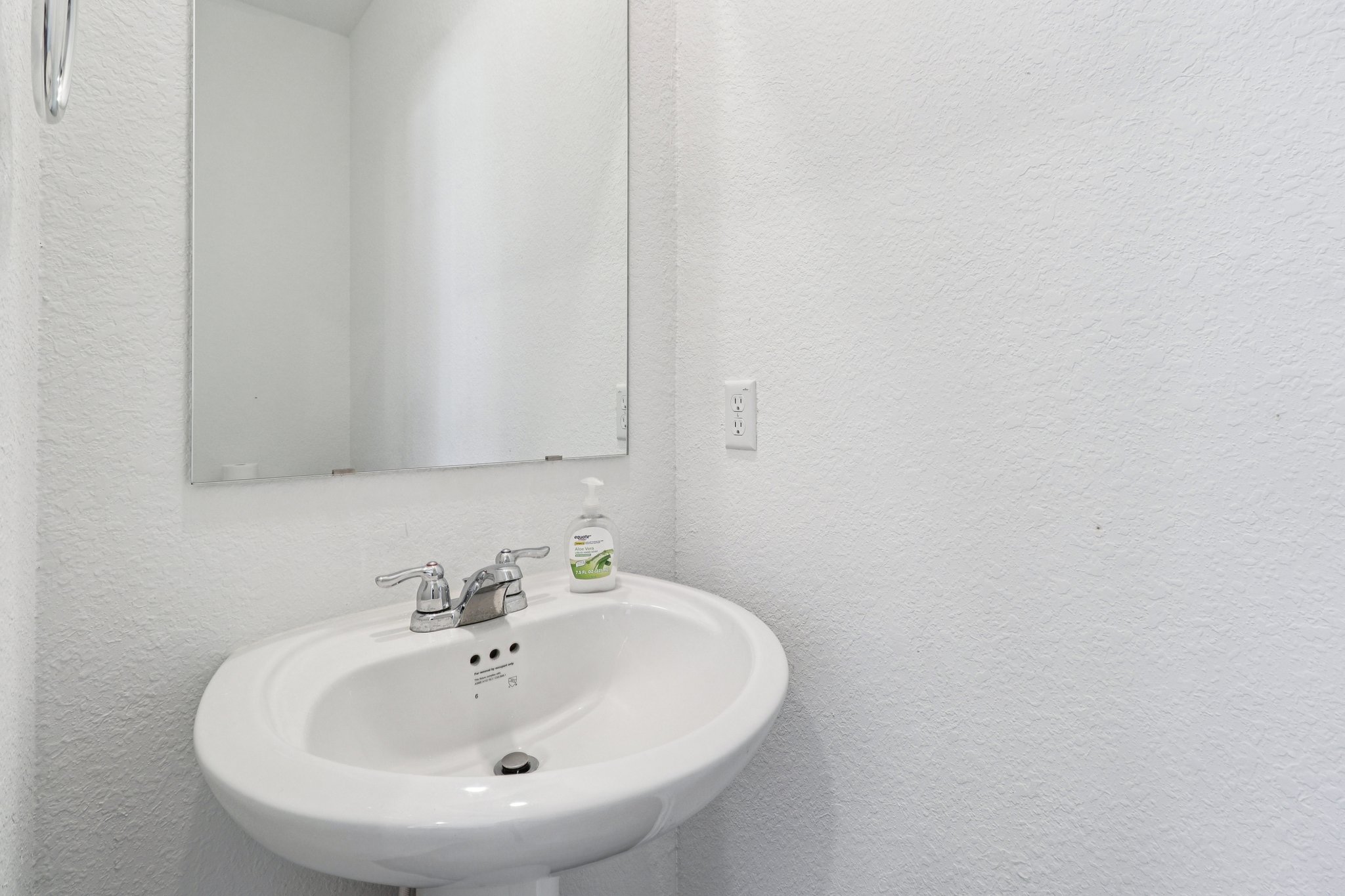 1201 Mallow Road Leander, TX 78641 - Photo 17 of 40 a bathroom with a sink and a mirror