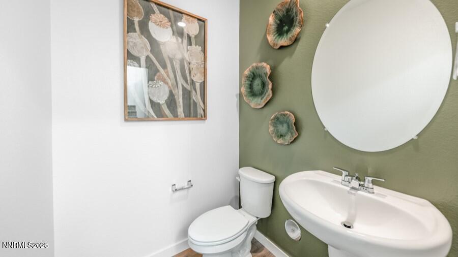 1029 Middle Gate Road Carson City, NV 89701 - Photo 12 of 25 a bathroom with a toilet and a sink