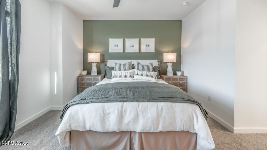 1029 Middle Gate Road Carson City, NV 89701 - Photo 18 of 25 a bedroom with a bed and a mirror