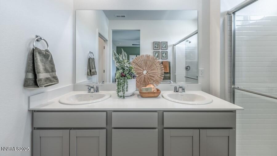 1029 Middle Gate Road Carson City, NV 89701 - Photo 21 of 25 a bathroom with a sink and a mirror