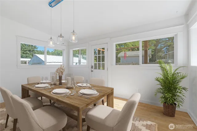 a view of a dining room with furniture window and wooden floor