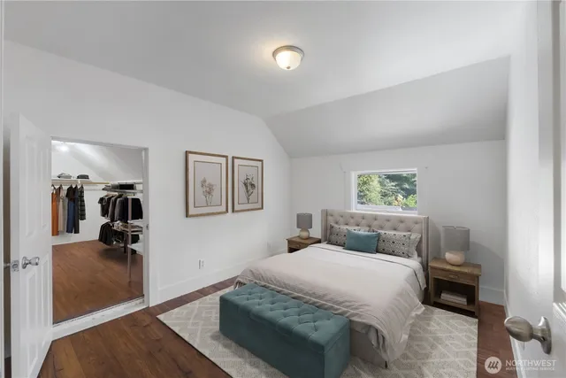 a bedroom with a bed and a view of bathroom