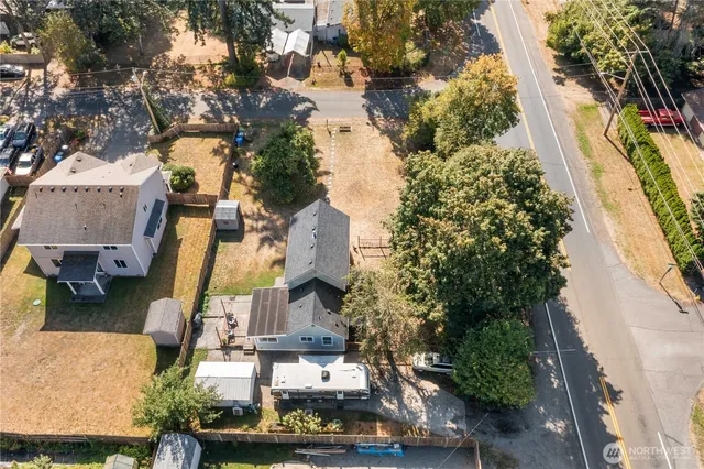 an aerial view of residential houses with outdoor space
