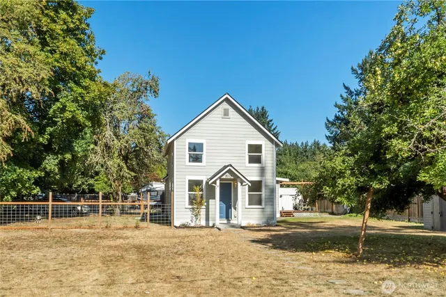 a view of a large house with a yard