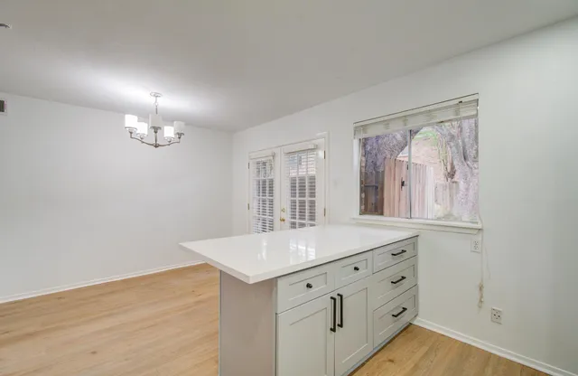 a bathroom with a sink vanity and mirror