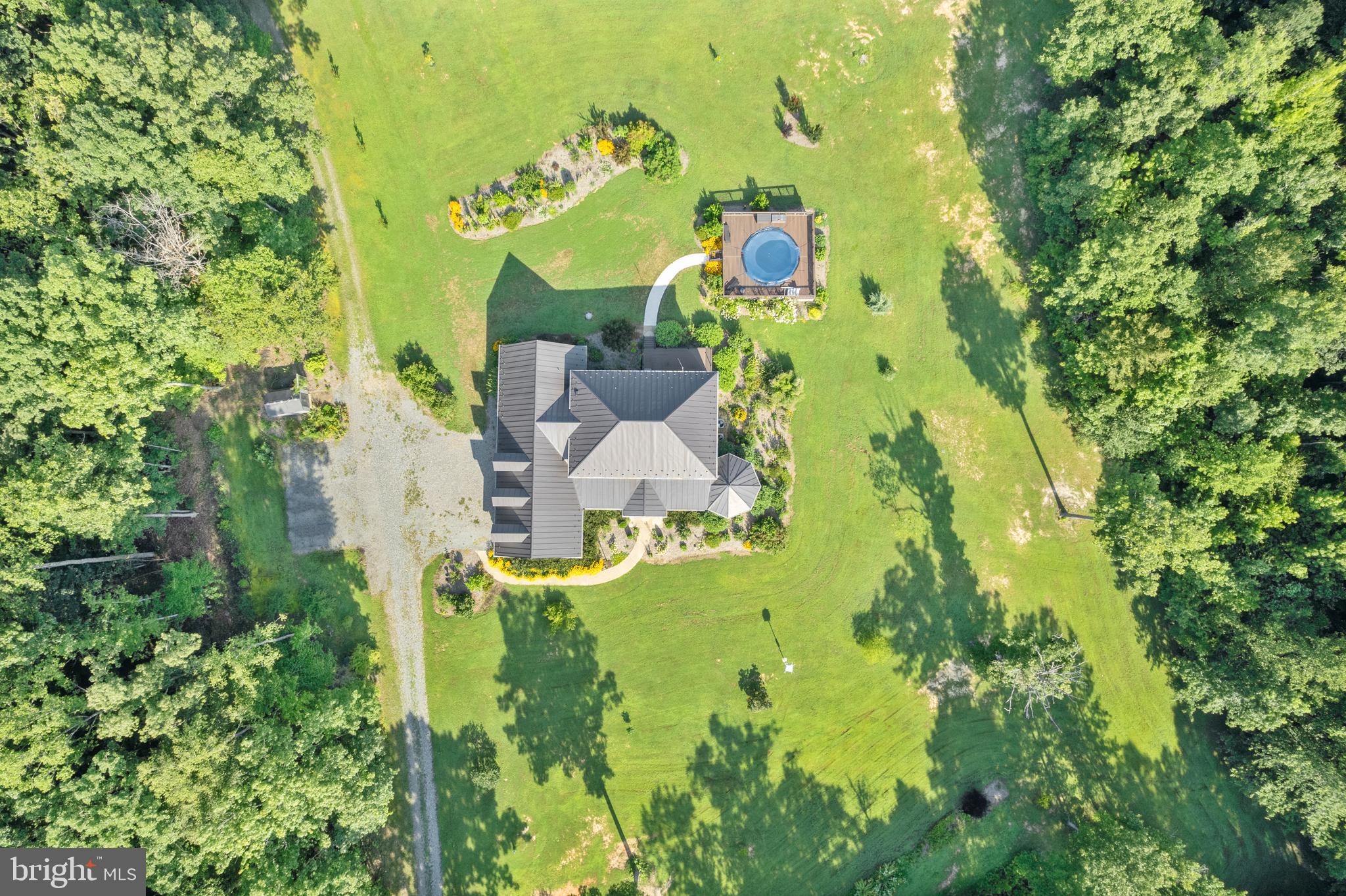 1185 Belle Meade Road Bumpass, VA 23024 - Photo 11 of 116 an aerial view of residential house with outdoor space and trees all around