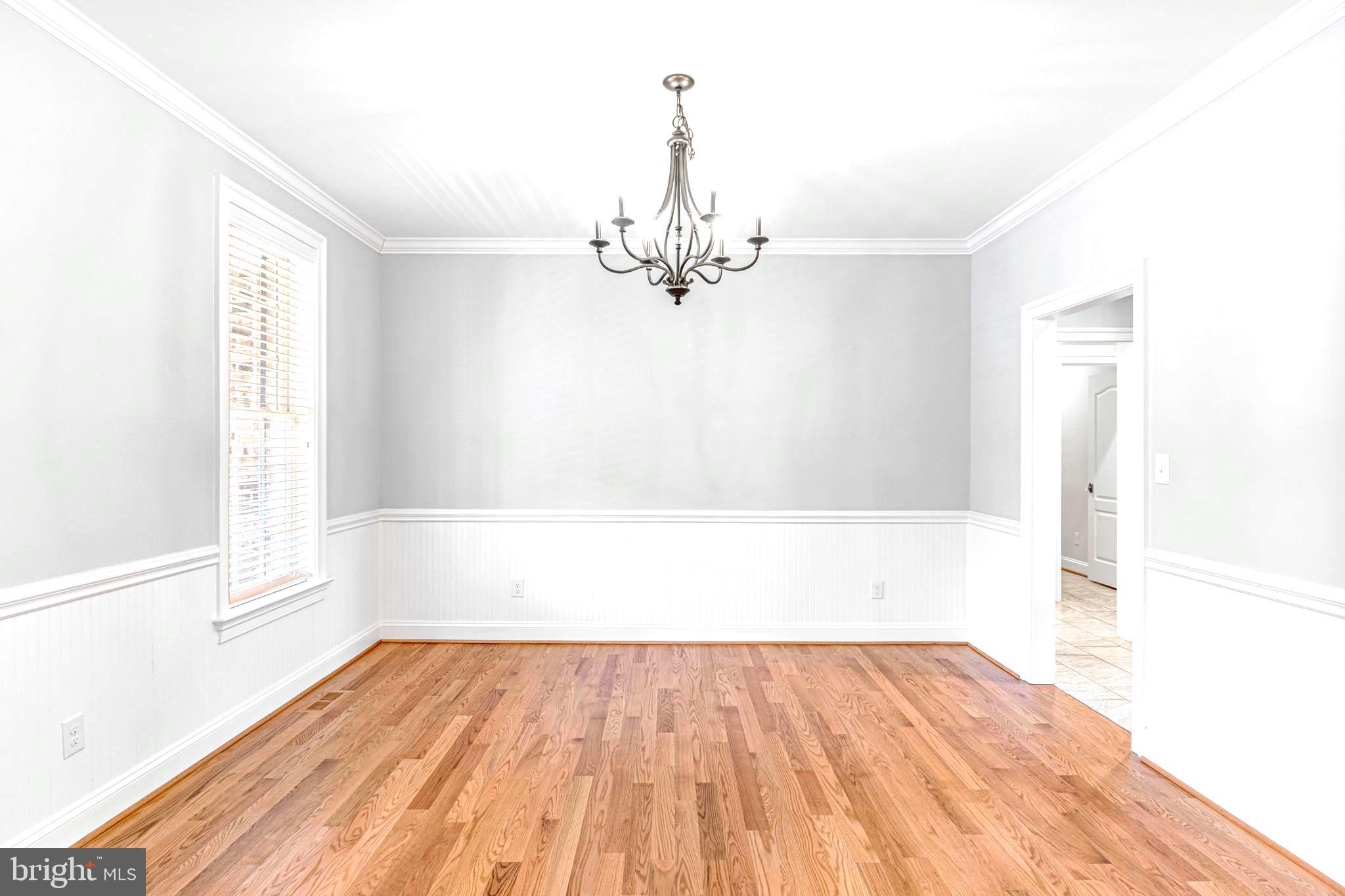 1185 Belle Meade Road Bumpass, VA 23024 - Photo 16 of 116 a view of a room with wooden floor and a ceiling fan