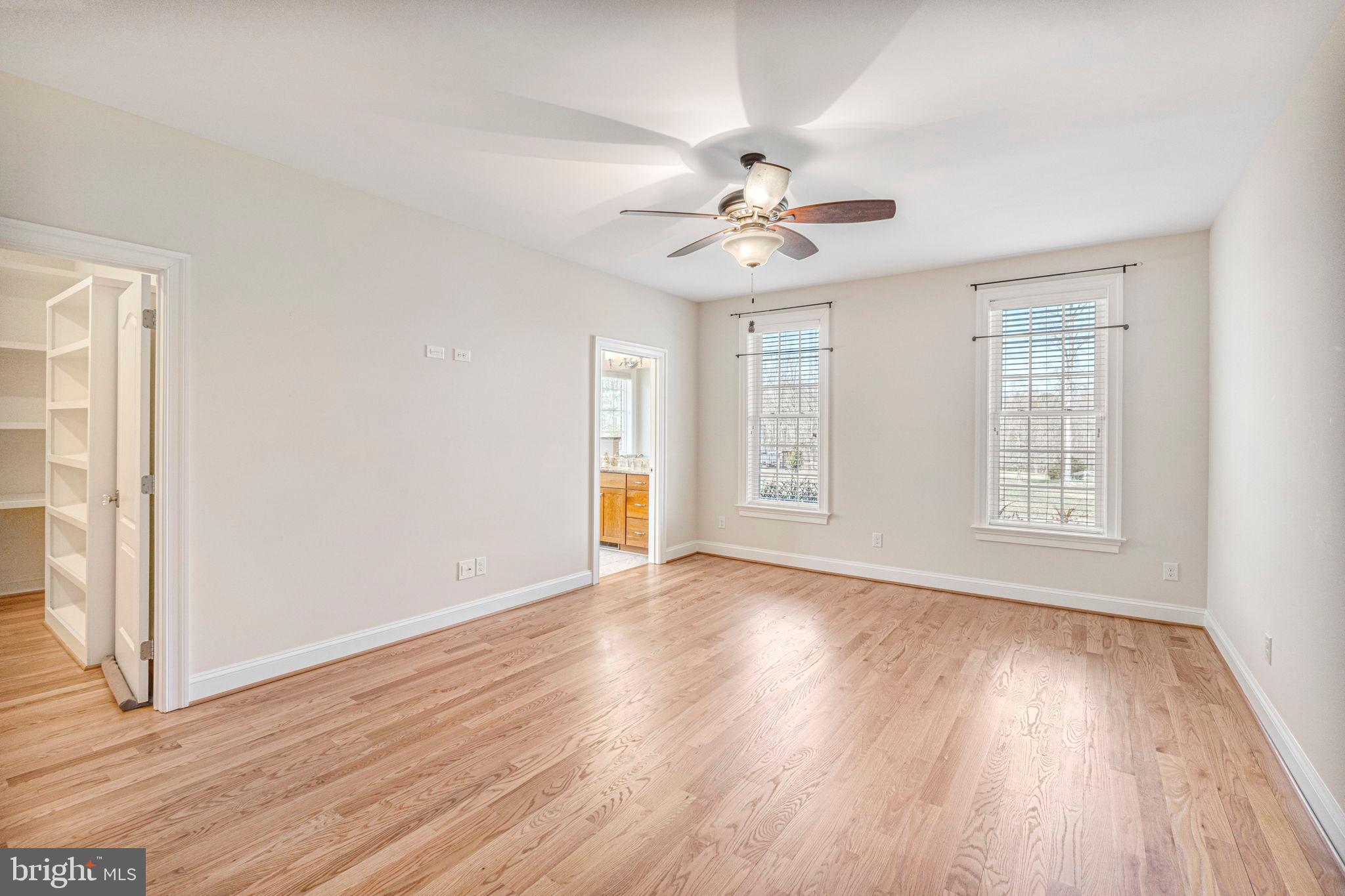 1185 Belle Meade Road Bumpass, VA 23024 - Photo 29 of 116 a view of an empty room with wooden floor and a window