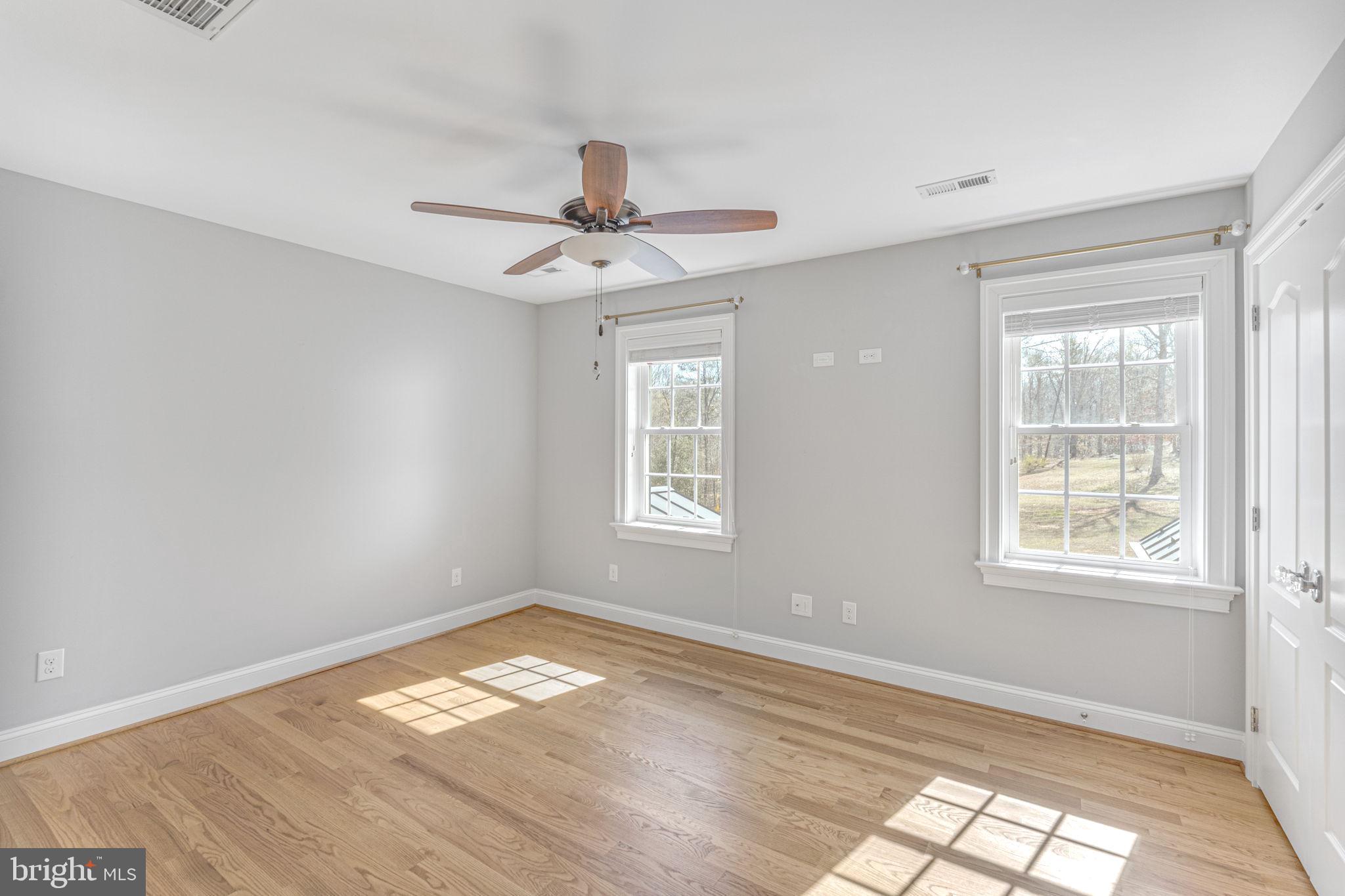 1185 Belle Meade Road Bumpass, VA 23024 - Photo 42 of 116 a view of empty room with wooden floor and fan