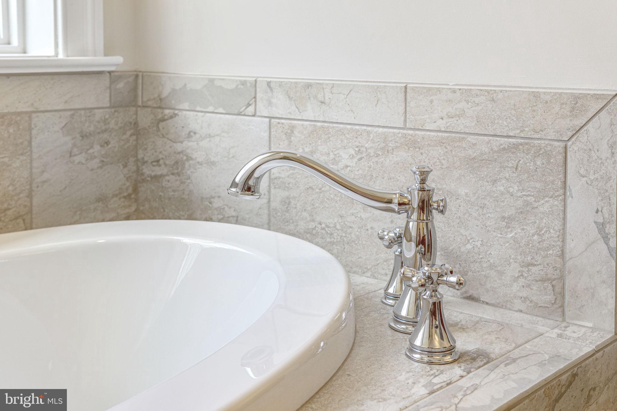 1185 Belle Meade Road Bumpass, VA 23024 - Photo 54 of 116 a white bath tub sitting in a bathroom