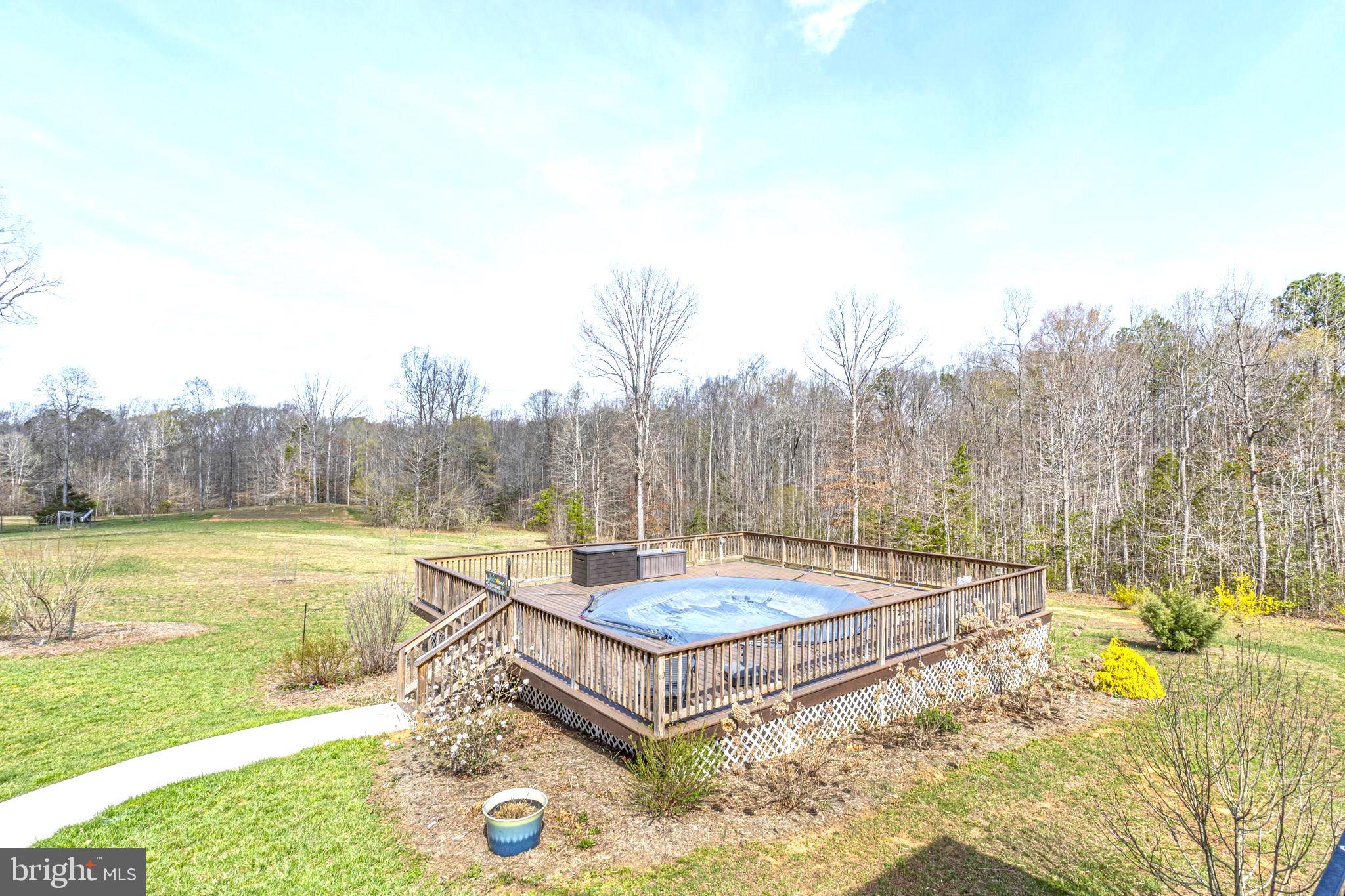 1185 Belle Meade Road Bumpass, VA 23024 - Photo 58 of 116 a view of a swimming pool with a lounge chair