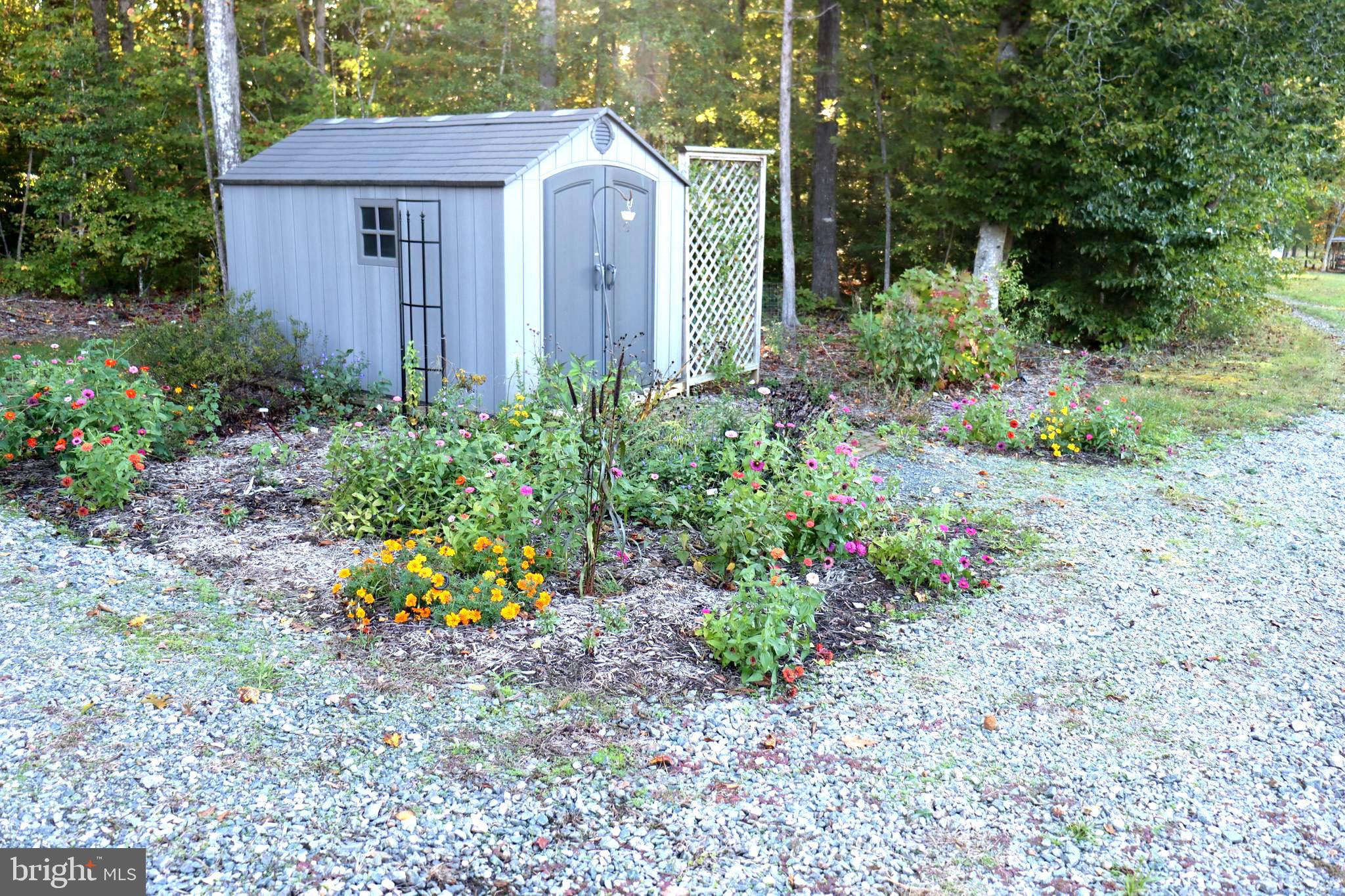 1185 Belle Meade Road Bumpass, VA 23024 - Photo 85 of 116 a view of a house with a yard and plants
