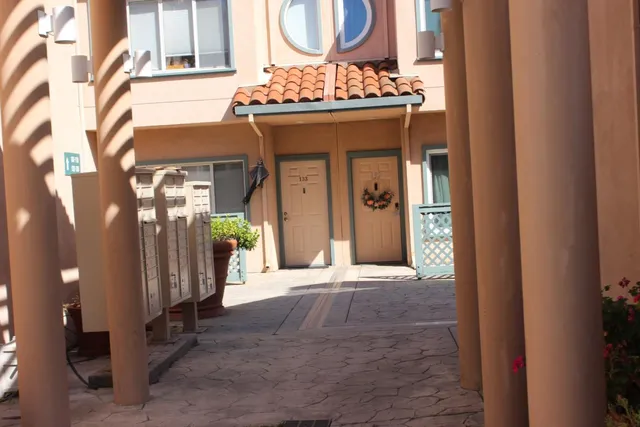 a view of gallery with mirror