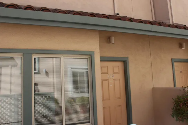 a bathroom with a shower and a mirror