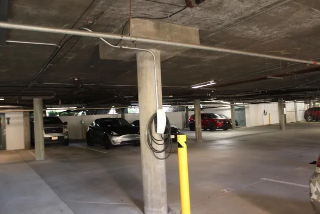 a view of parking garage with cars