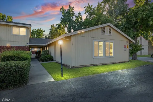 a front view of a house with yard