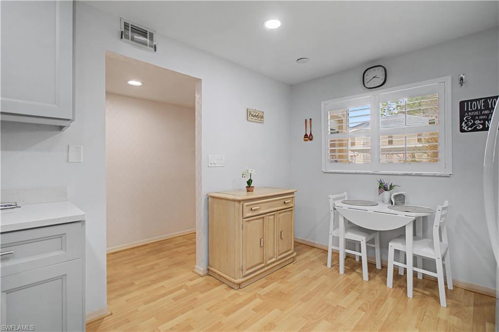 741 Landover Circle, Unit 102 Naples, FL 34104 - Photo 12 of 27 a workspace with furniture and window