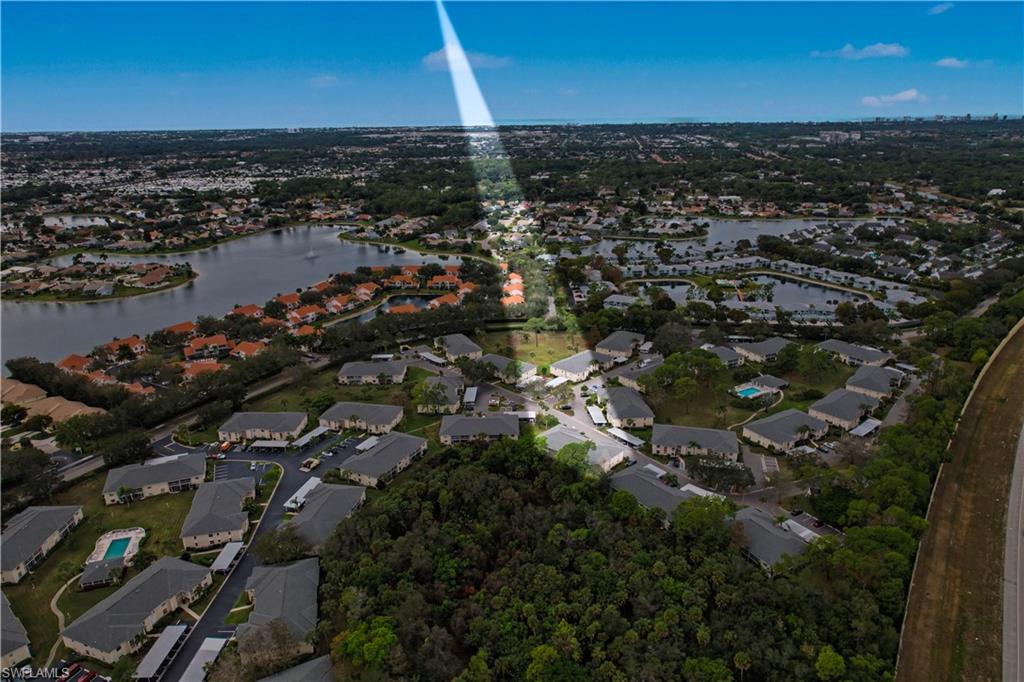 741 Landover Circle, Unit 102 Naples, FL 34104 - Photo 2 of 27 an aerial view of a city