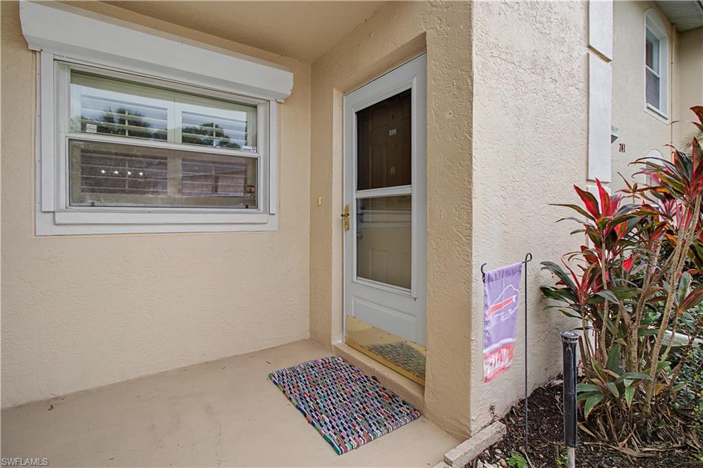 741 Landover Circle, Unit 102 Naples, FL 34104 - Photo 5 of 27 a view of an outdoor space