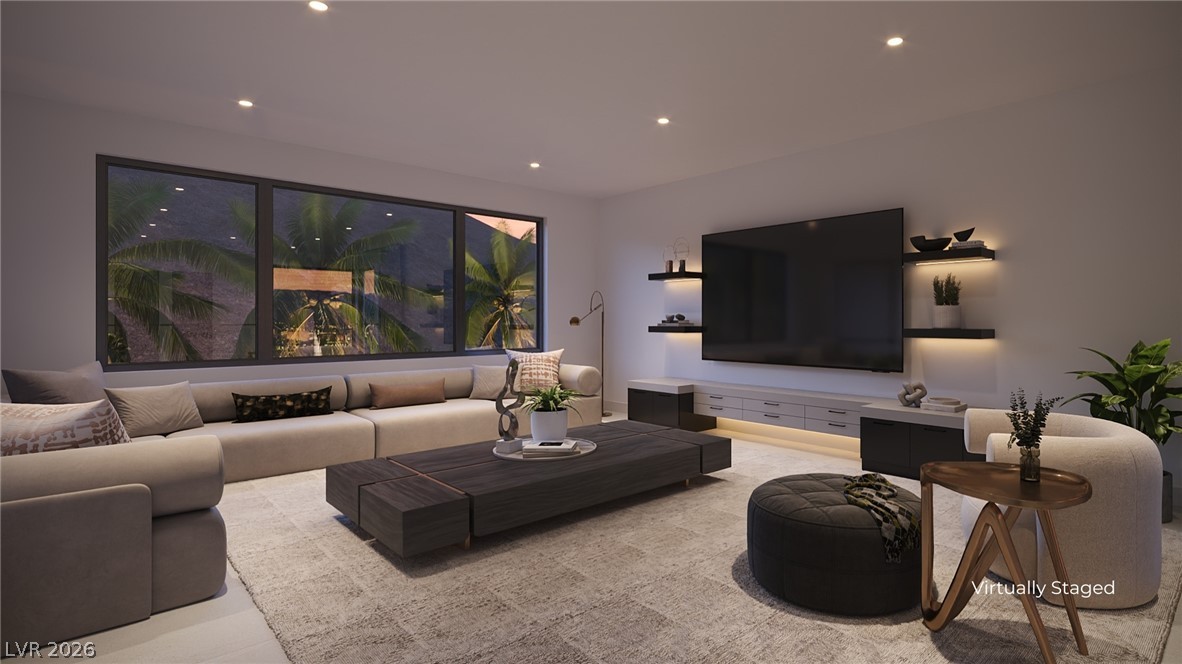 505 Overlook Rim Drive Henderson, NV 89012 - Photo 10 of 22 A refined living area boasts abundant light, recessed lighting, and ample space for relaxation.