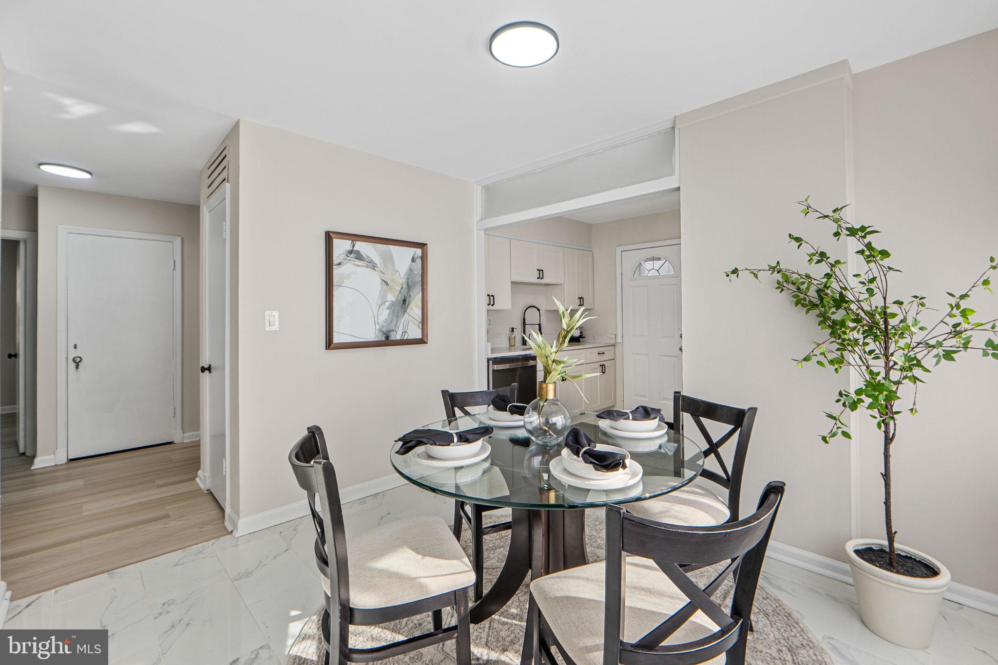 1513 Flora Lane Silver Spring, MD 20910 - Photo 11 of 50 a view of a dining room with furniture and potted plant