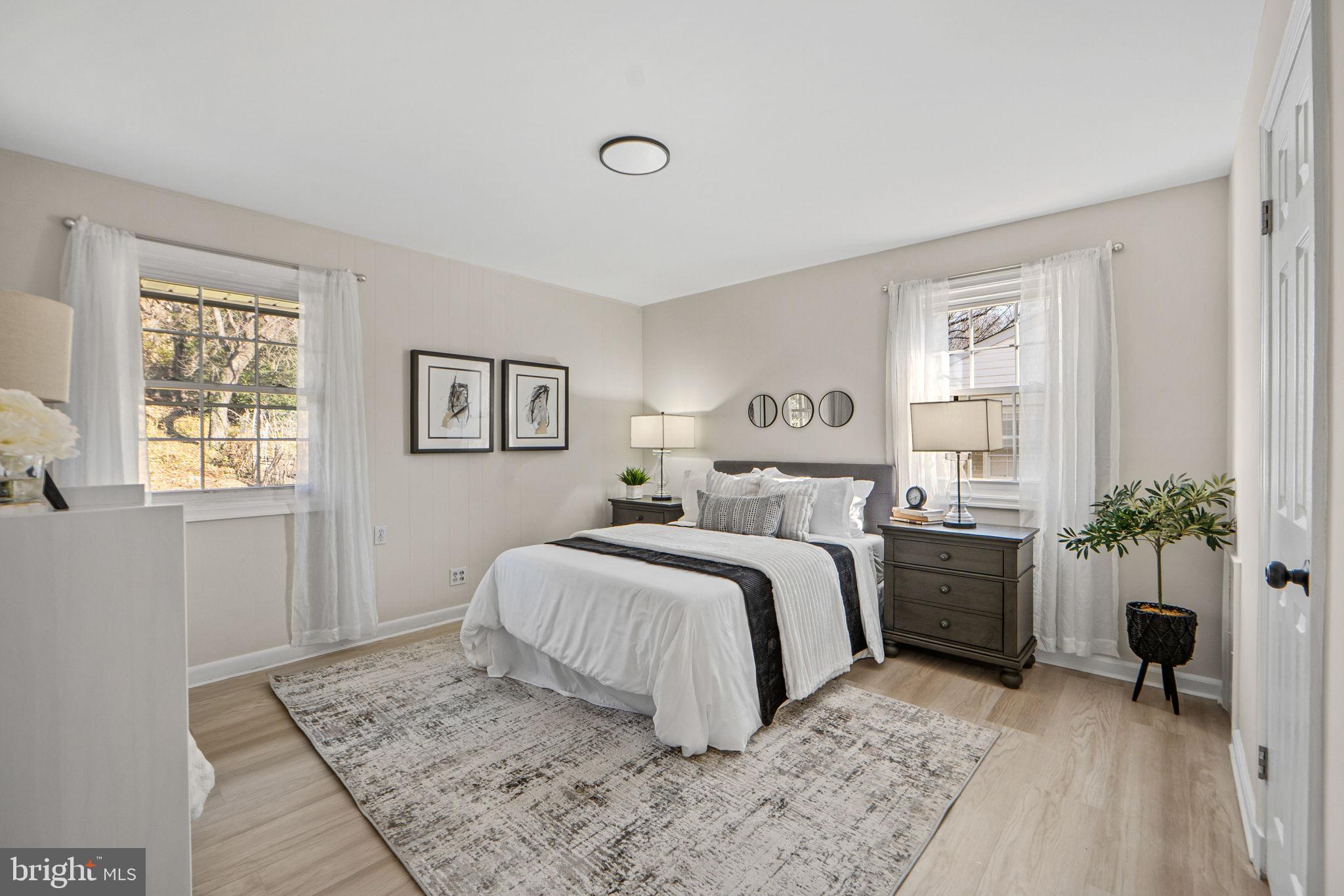 1513 Flora Lane Silver Spring, MD 20910 - Photo 17 of 50 a bedroom with a large bed and a window