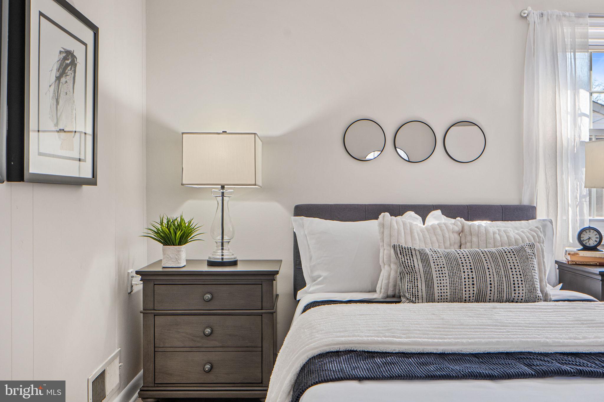 1513 Flora Lane Silver Spring, MD 20910 - Photo 18 of 50 a bedroom with a bed and a window