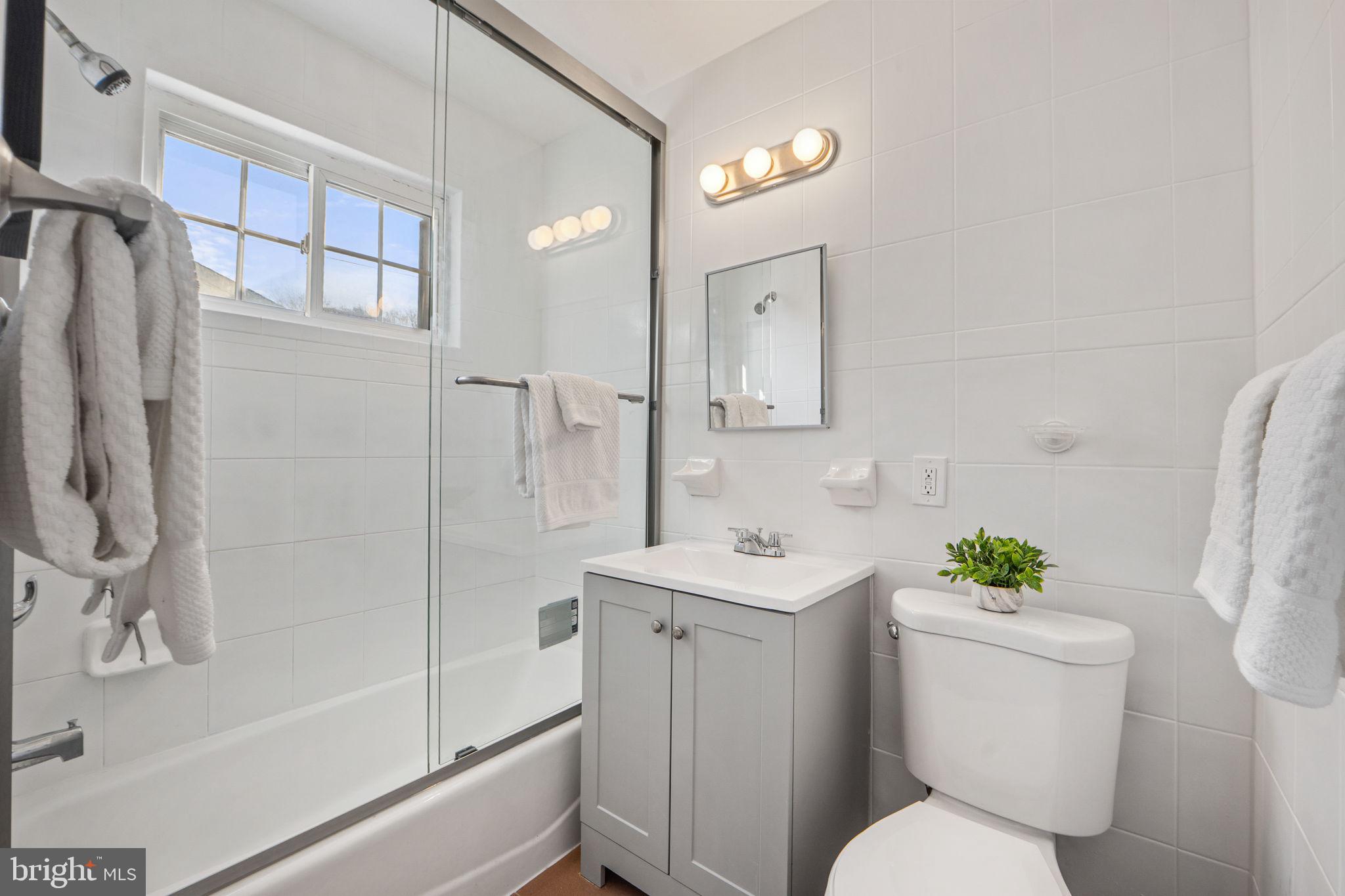 1513 Flora Lane Silver Spring, MD 20910 - Photo 20 of 50 a white toilet sitting next to a bathroom sink