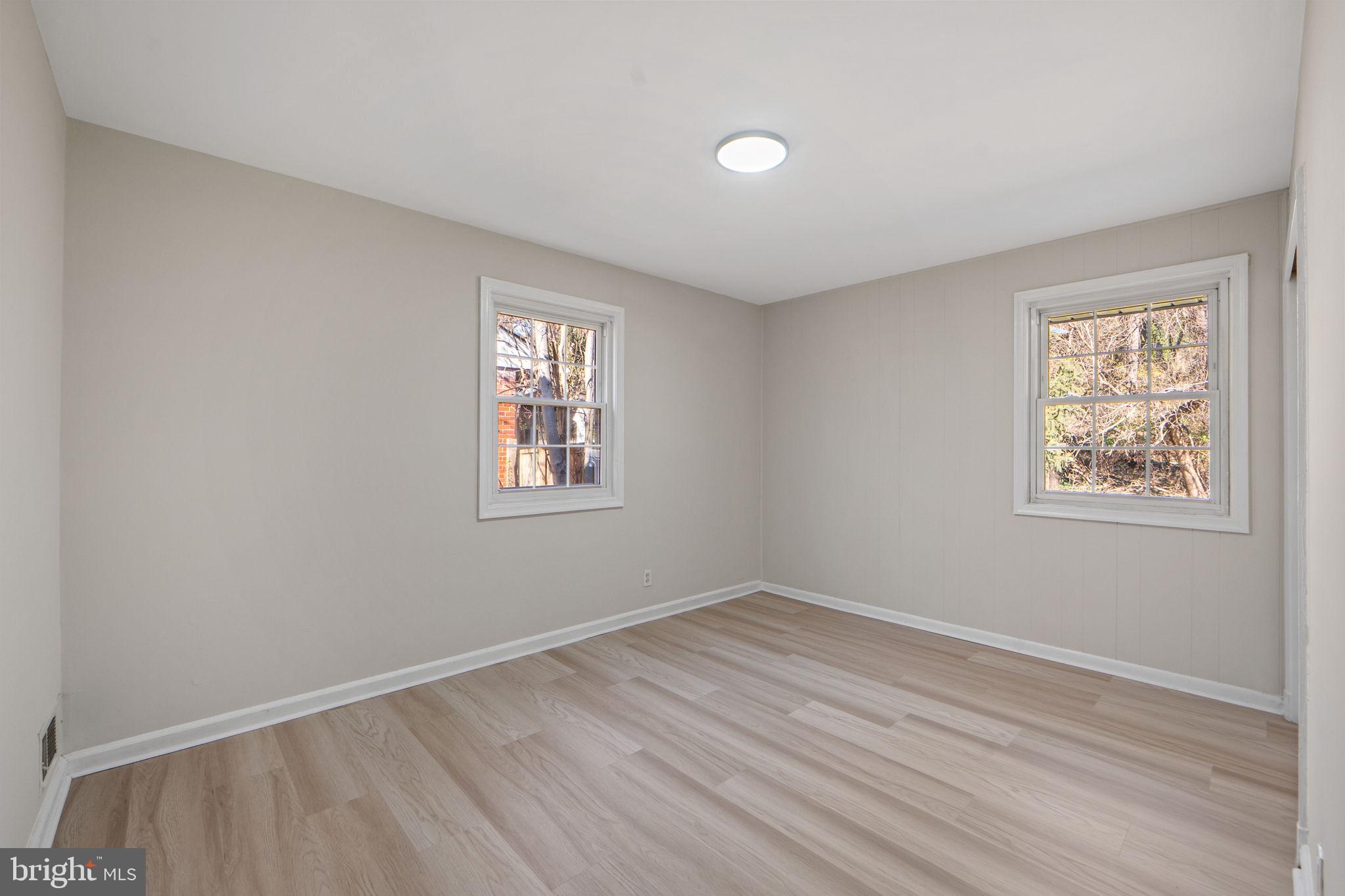1513 Flora Lane Silver Spring, MD 20910 - Photo 21 of 50 wooden floor in an empty room with a window