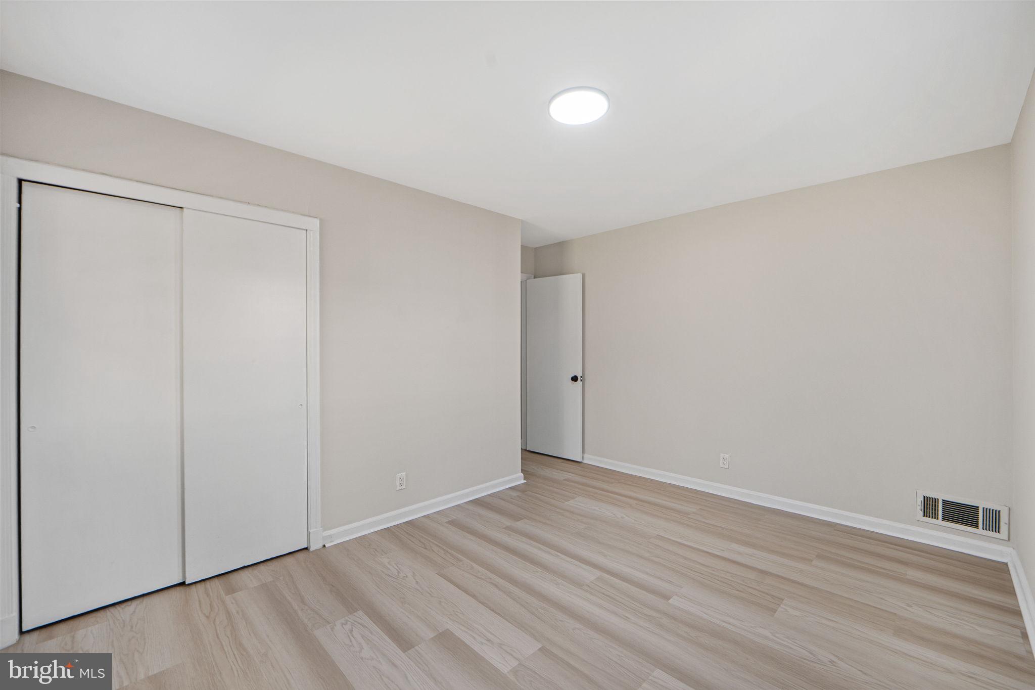 1513 Flora Lane Silver Spring, MD 20910 - Photo 22 of 50 a view of an empty room with wooden floor