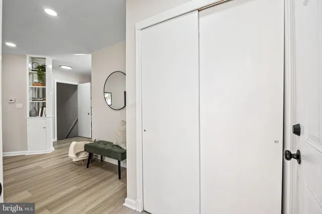 a view of a room with wooden floor and furniture