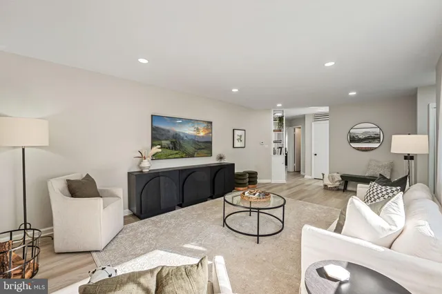 a living room with furniture and a table