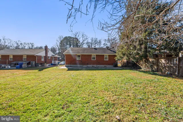 a view of house with a swimming pool