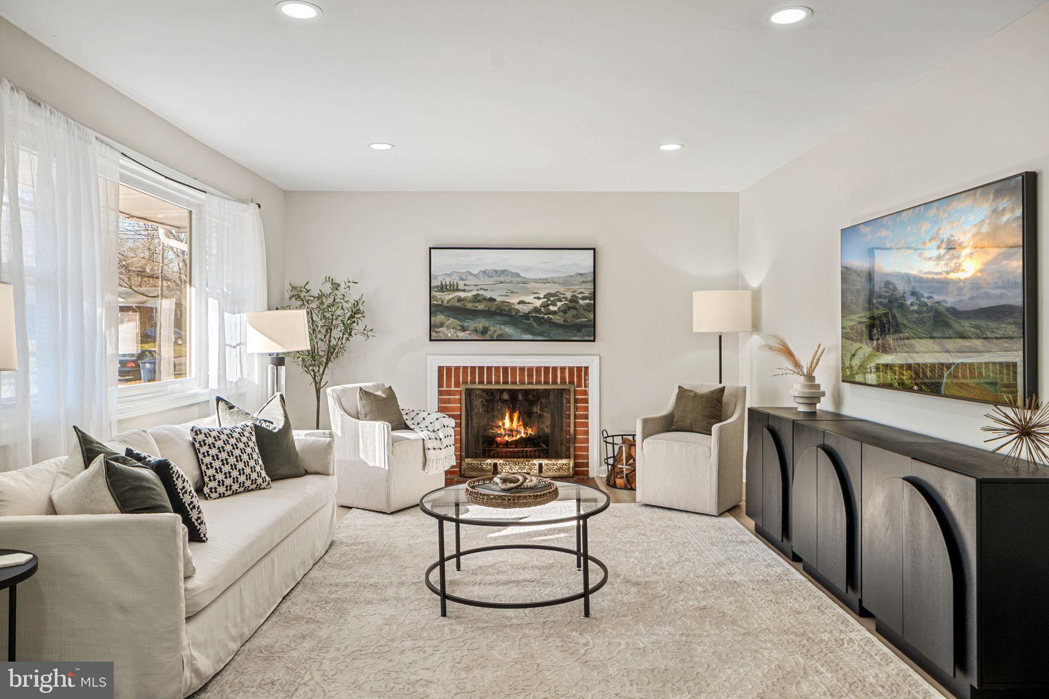 1513 Flora Lane Silver Spring, MD 20910 - Photo 6 of 50 a living room with furniture a fireplace and a flat screen tv