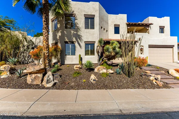 a view of houses with a street