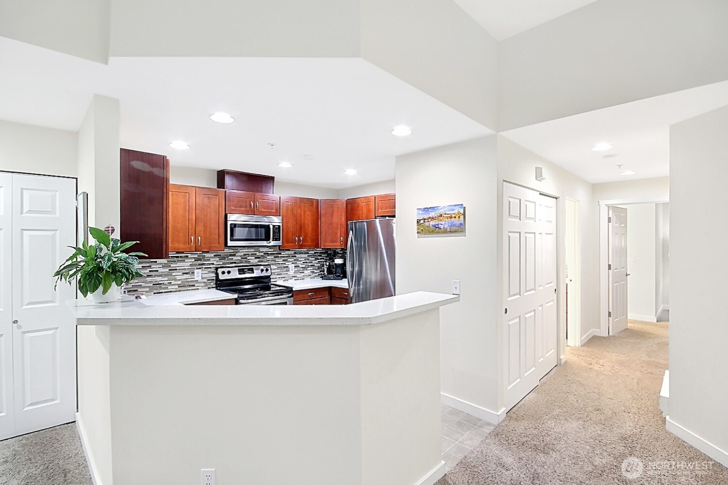 5921 South 234th Place Kent, WA 98032 - Photo 11 of 25 a view of a kitchen with stainless steel appliances granite countertop a refrigerator and a sink
