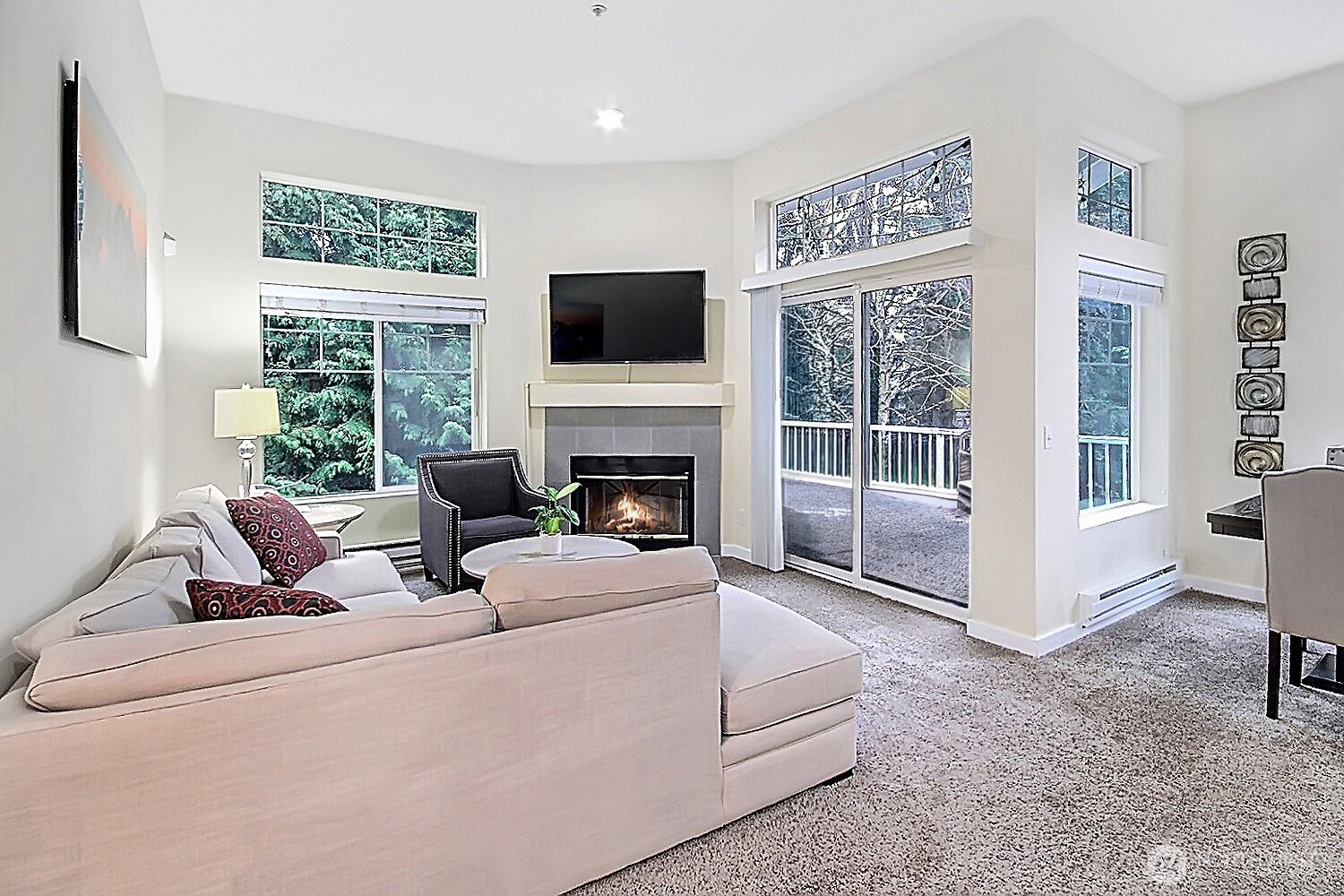 5921 South 234th Place Kent, WA 98032 - Photo 13 of 25 a living room with furniture a flat screen tv and a large window