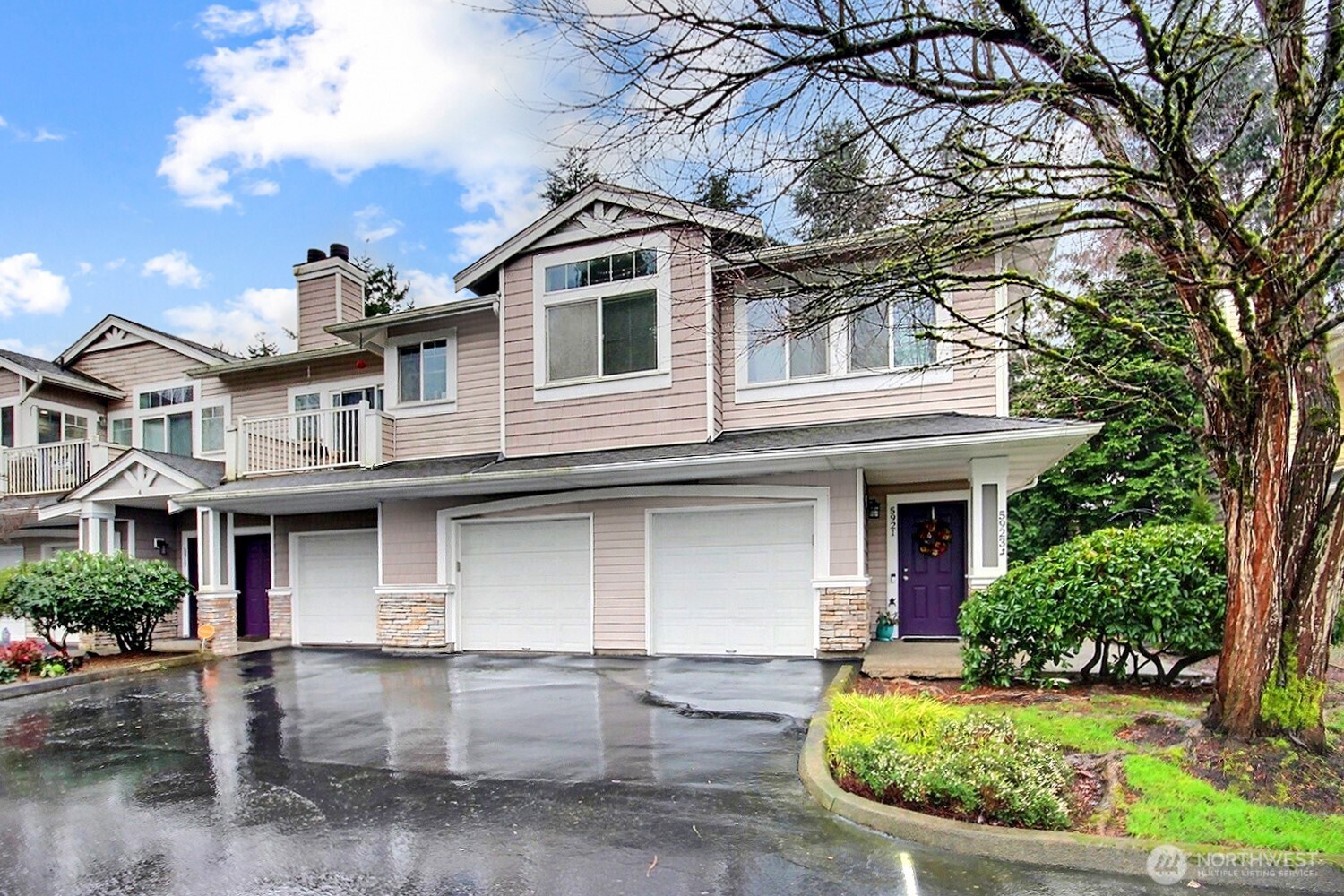 5921 South 234th Place Kent, WA 98032 - Photo 2 of 25 a front view of a house with garden