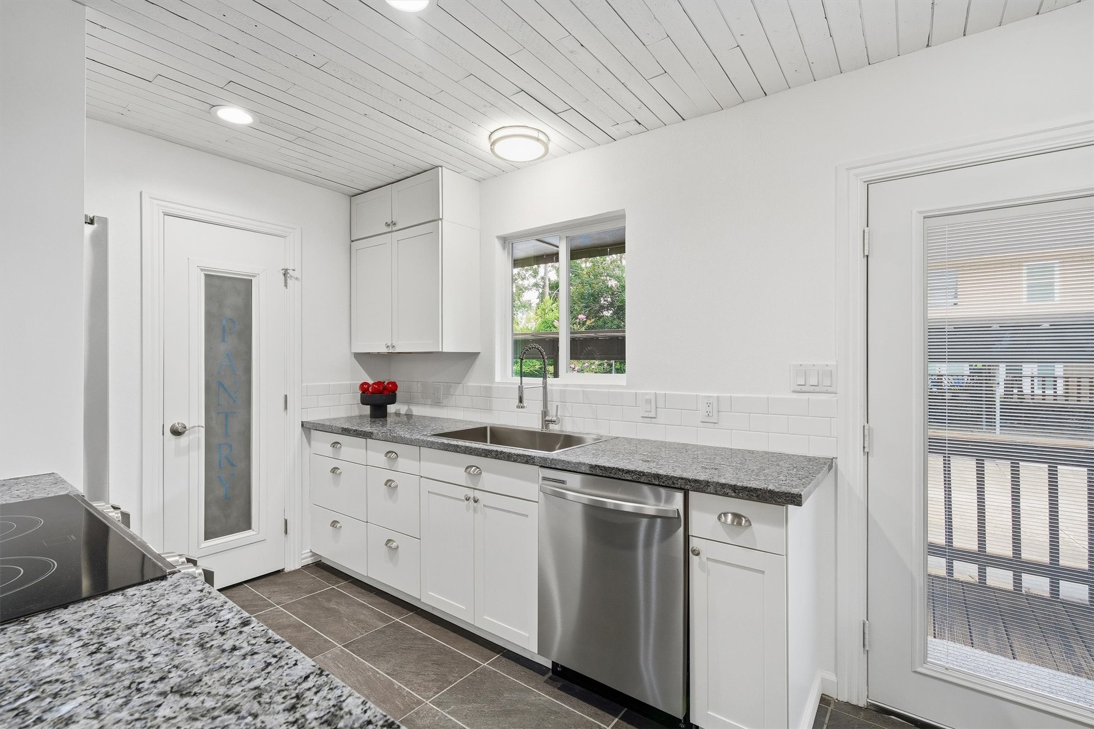 1011 Hamblen Road, Unit 306 Houston, TX 77339 - Photo 12 of 38 Tucked beside the window, the sink area brings in natural light while overlooking the back deck, so even dish duty comes with a decent view.