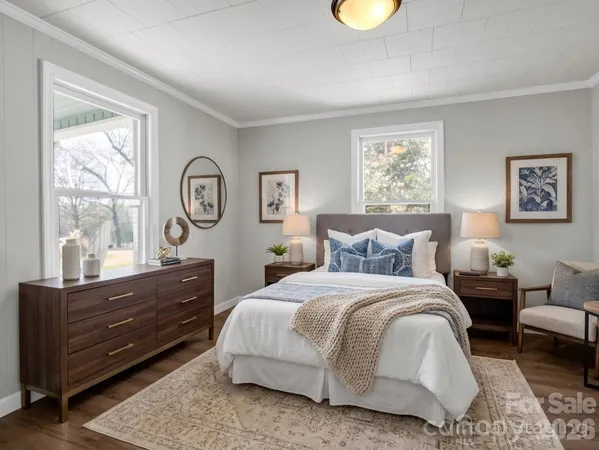 a bedroom with furniture and a window