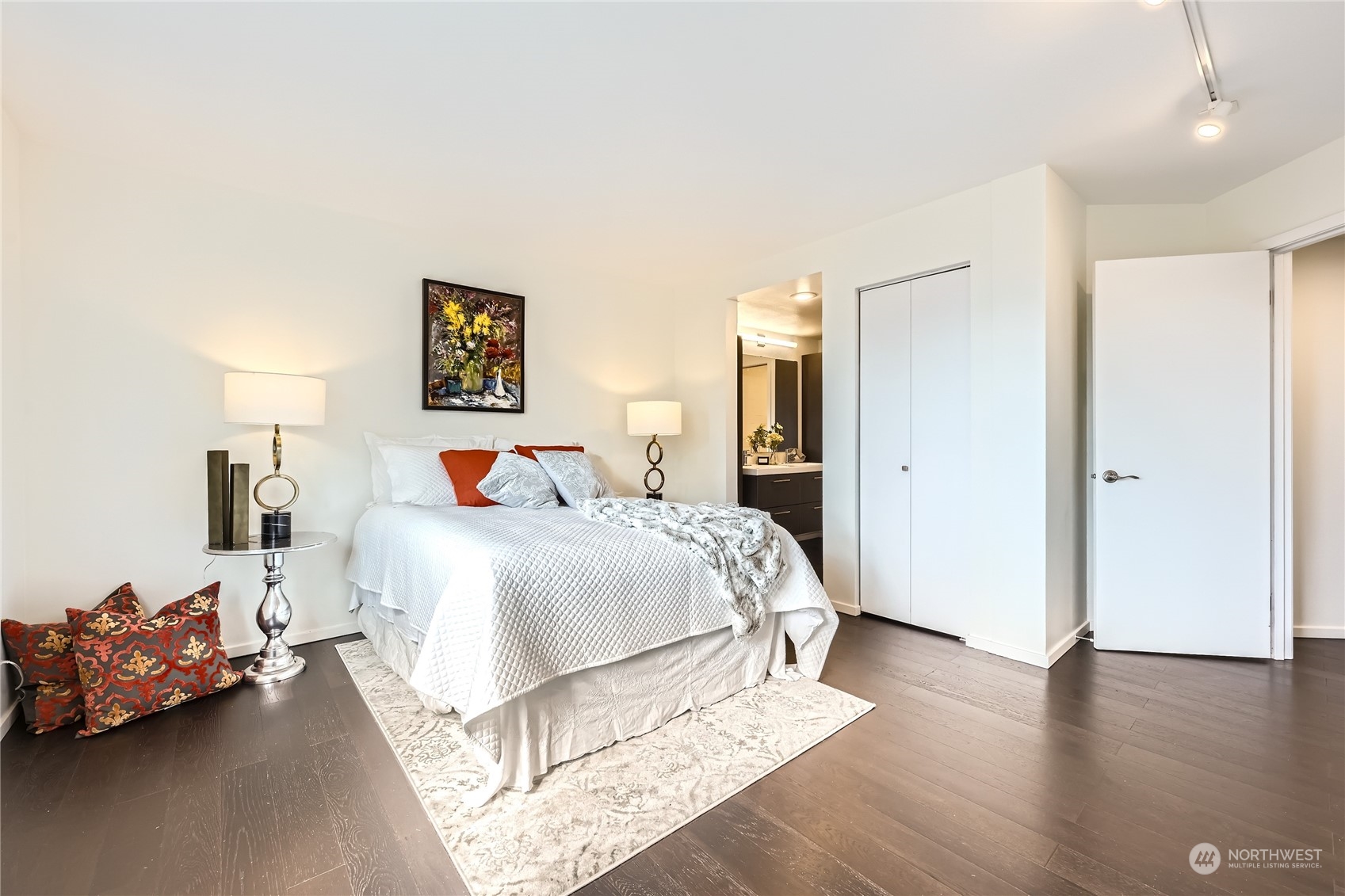 619 5th Avenue West, Unit 401 Seattle, WA 98119 - Photo 13 of 29 a bedroom with a bed and wooden floor